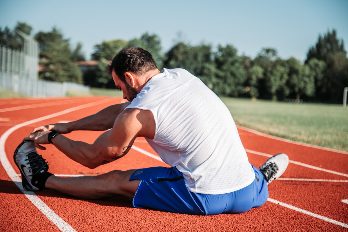 Person practicing light joint warm-up exercises outdoors