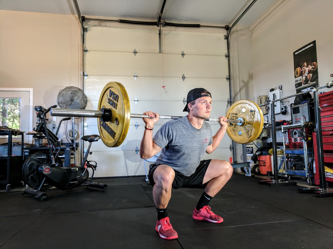 Person lifting weights safely with joint support